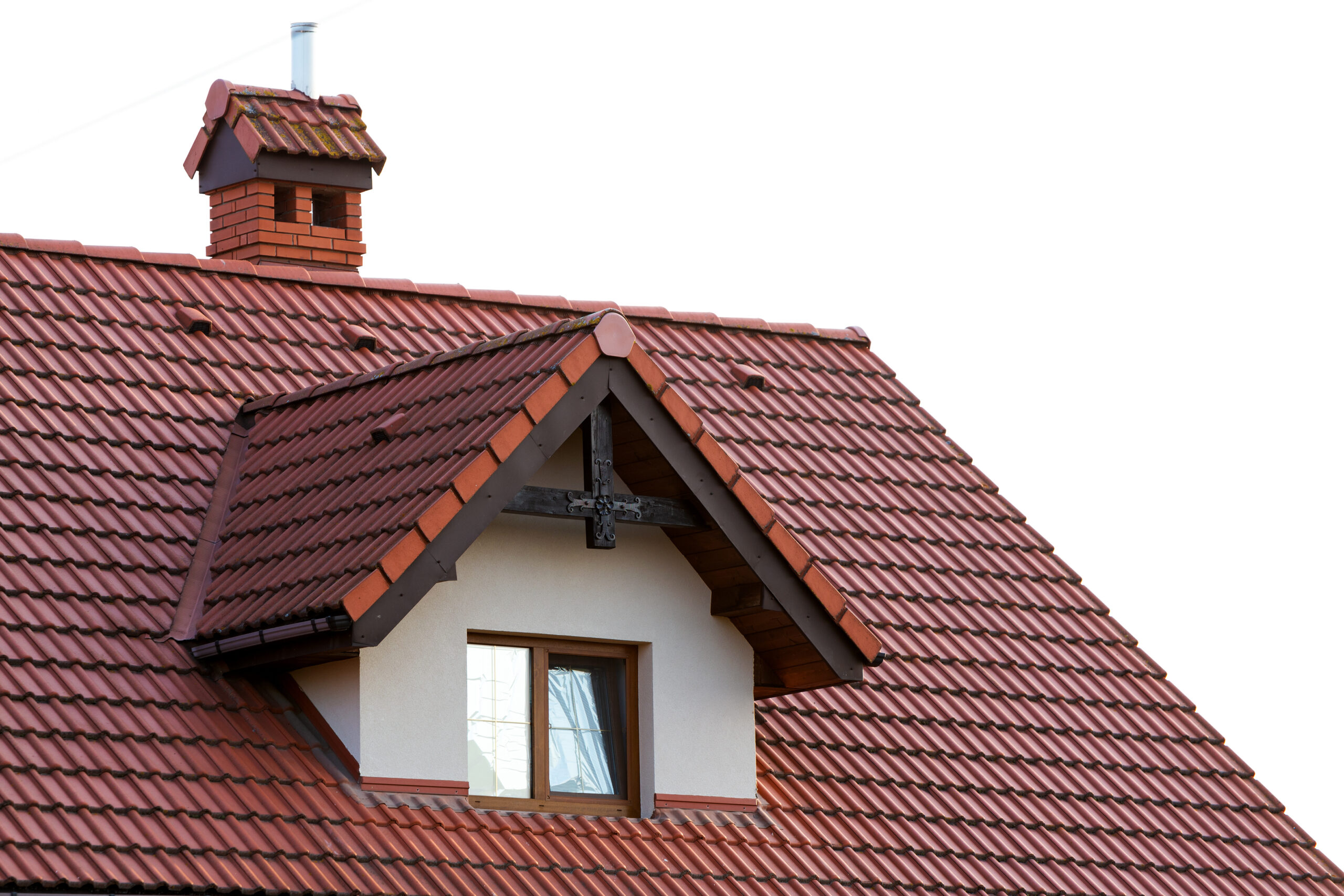Close up of new orange roof with chimney and small modern loft conversion
